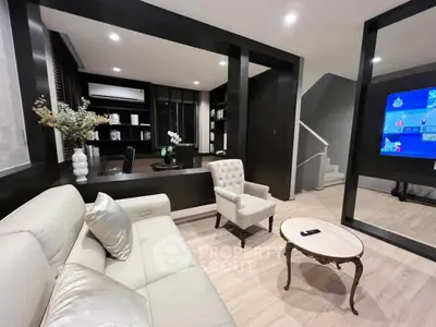 Luxurious modern living room with elegant decor and cozy seating area, perfect for relaxation and entertainment.
