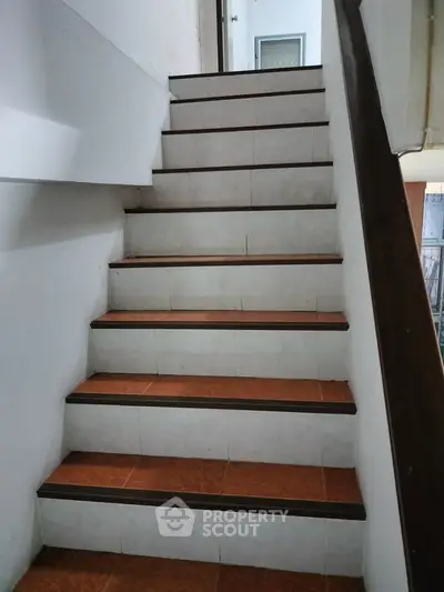 Charming staircase with wooden accents in cozy home setting