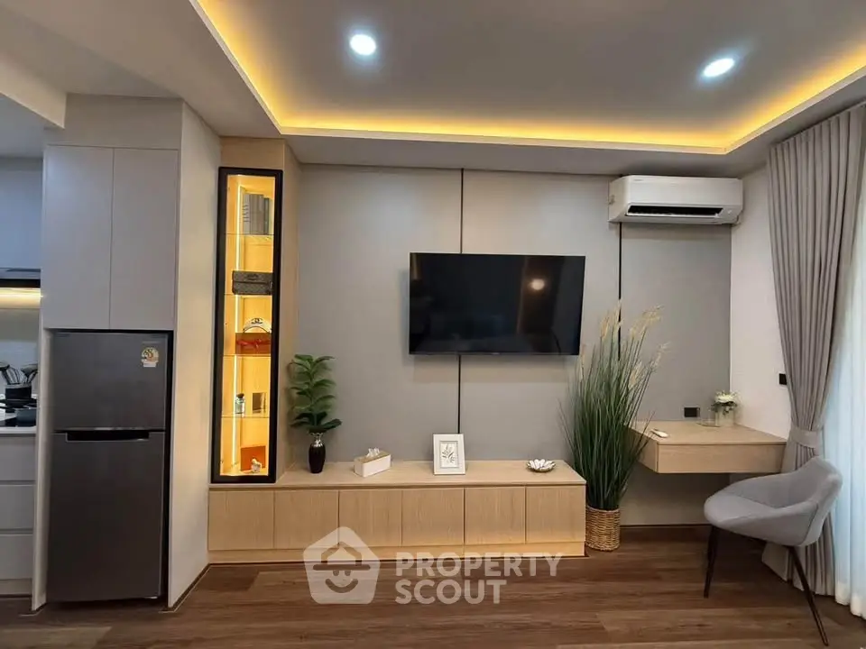 Modern living room with sleek design, wall-mounted TV, and stylish decor