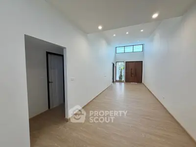Spacious modern living room with high ceilings and natural light