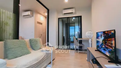 Modern living room with cozy sofa, air conditioning, and stylish decor in a contemporary apartment.