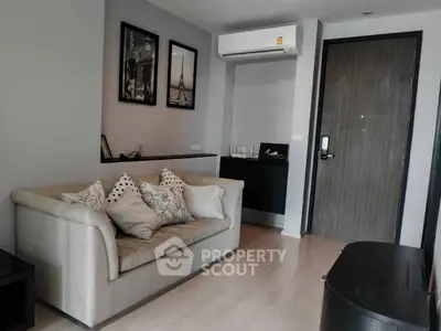 Modern living room with stylish decor and comfortable sofa in a cozy apartment.