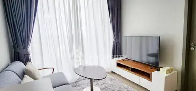 Modern living room with elegant curtains and sleek TV setup