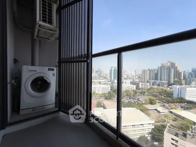 High-rise balcony with washing machine and stunning city view