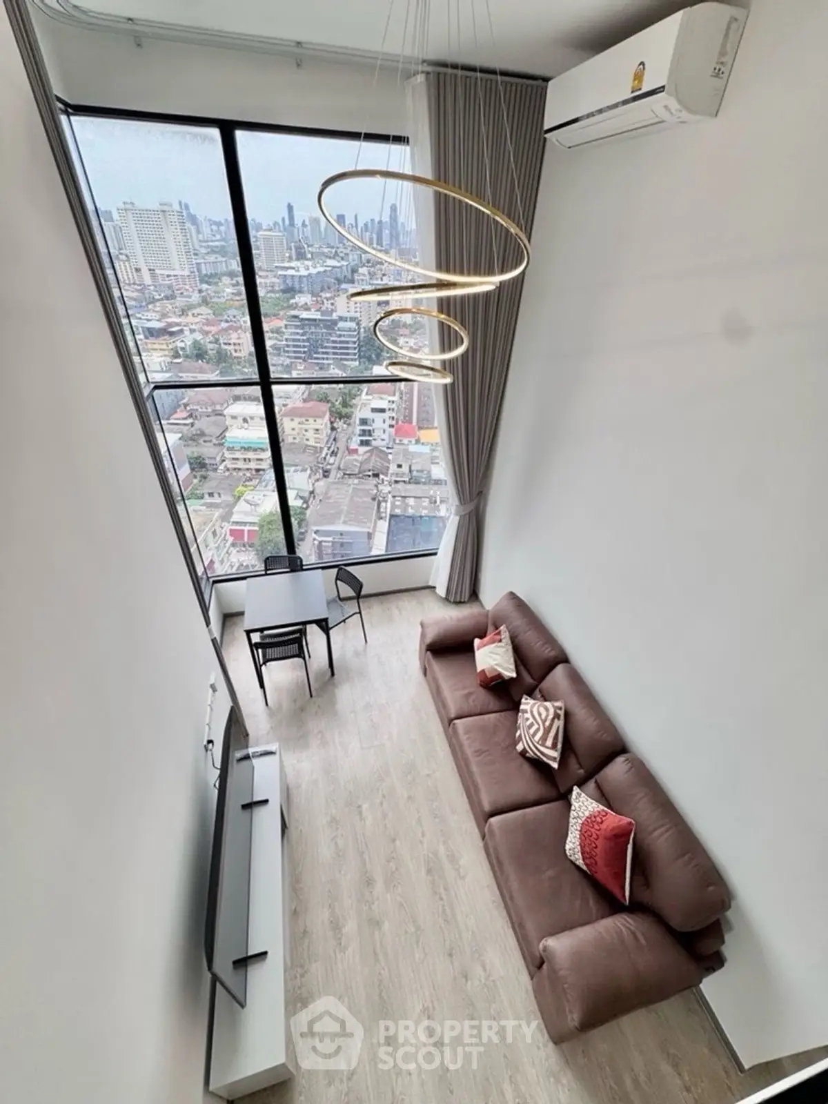 Stunning high-rise living room with panoramic city view and modern decor