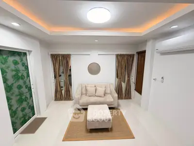 Modern living room with elegant lighting and cozy beige sofa set