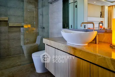 Luxurious modern bathroom with elegant fixtures and glass shower enclosure