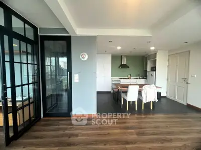 Modern open-plan kitchen and dining area with sleek design and natural light.