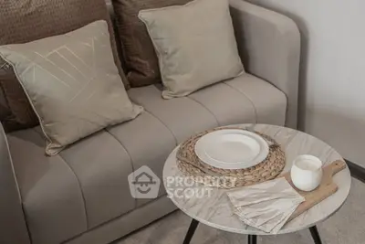 Stylish living room with modern sofa and chic marble table setting