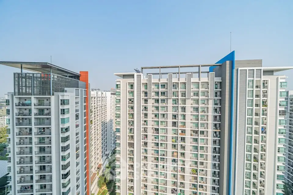 Modern high-rise residential buildings with sleek architecture and panoramic city views.
