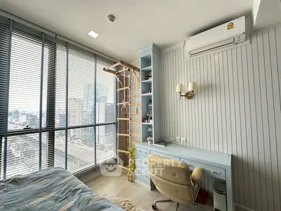Modern bedroom with city view, featuring a stylish desk, chair, and wall-mounted air conditioner.