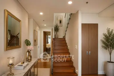 Elegant interior with wooden staircase and modern decor in a stylish home