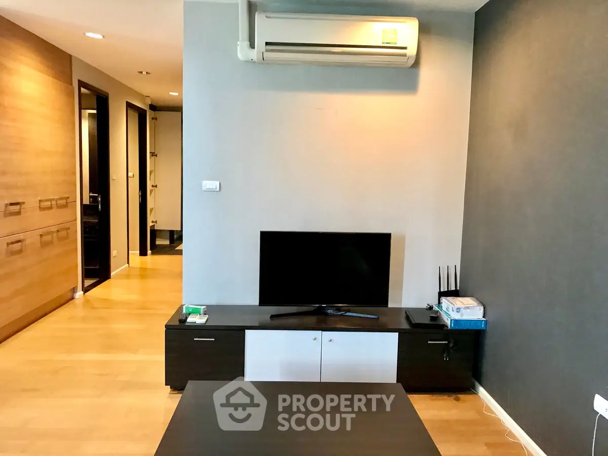 Modern living room with air conditioning and sleek TV setup