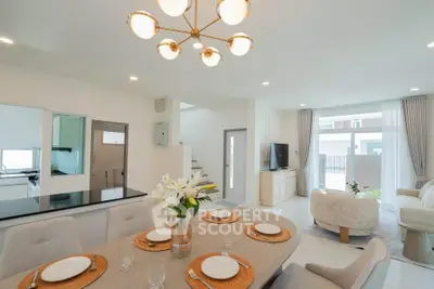 Spacious modern living room with elegant dining area and open kitchen layout