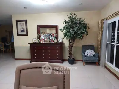 Spacious living room with elegant decor and large windows for natural light.