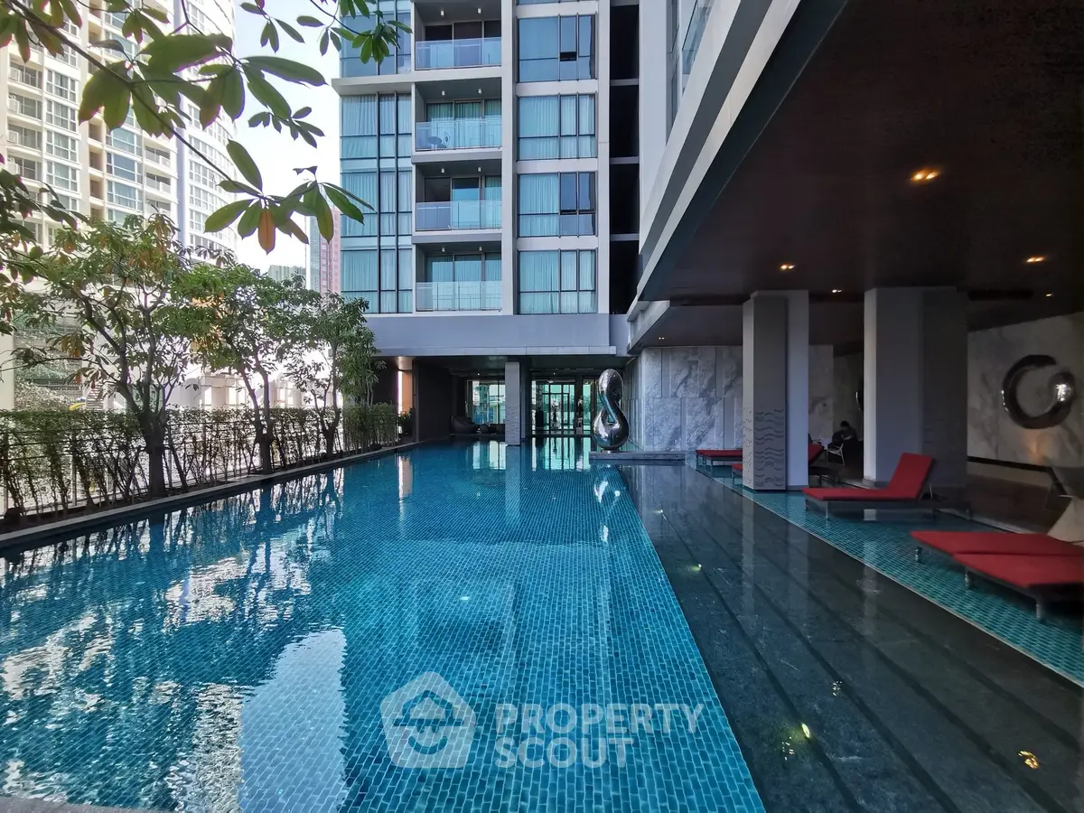 Luxurious condominium with stunning poolside view and modern architecture.