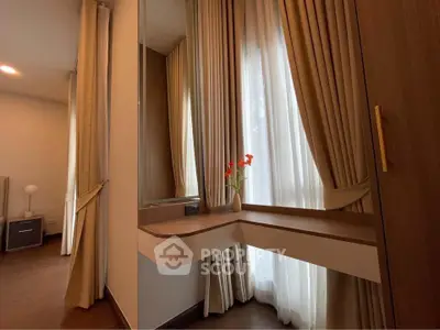 Elegant bedroom corner with stylish curtains and modern wooden furniture