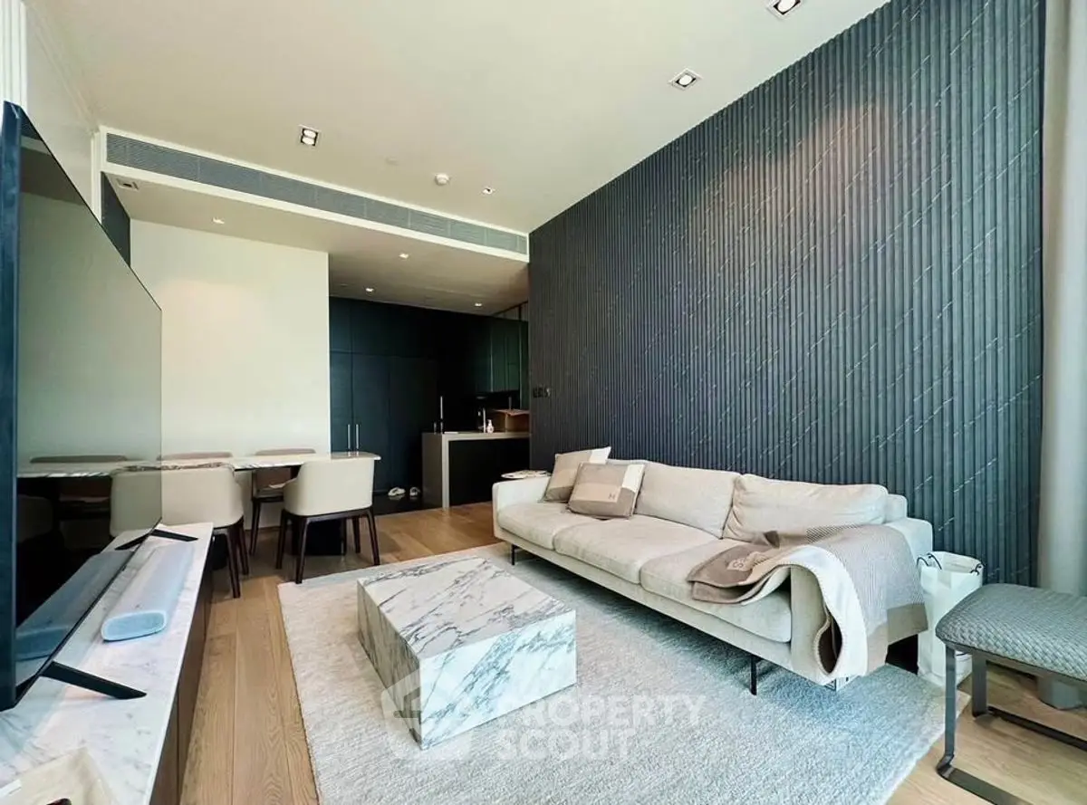 Modern living room with elegant decor and open kitchen layout
