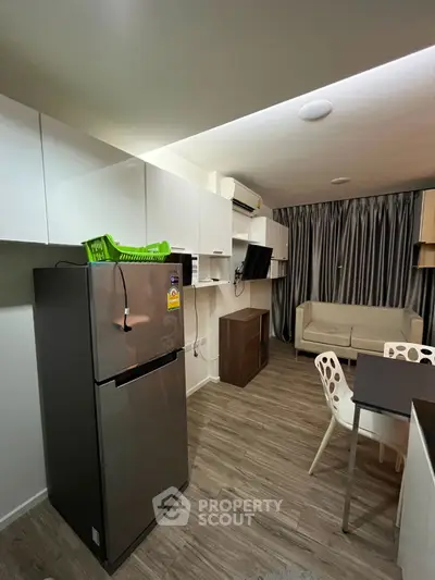 Modern apartment interior with sleek kitchen and cozy living area