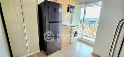 Modern kitchen with sleek appliances and balcony view