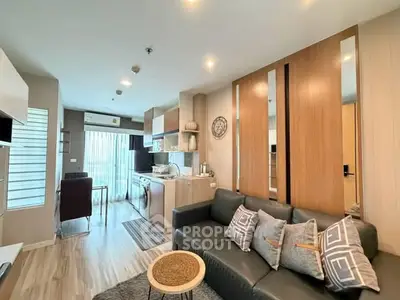 Modern open-plan living room with stylish decor and natural light