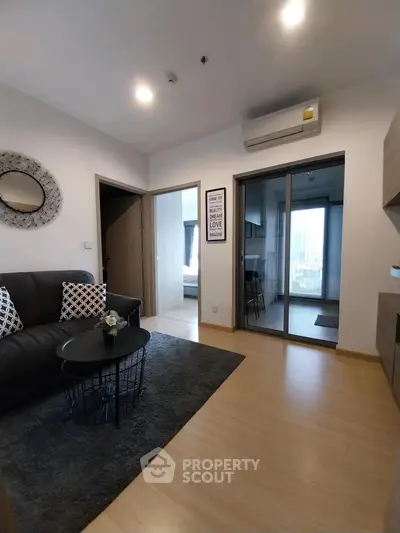 Modern living room with sleek design and cozy atmosphere, featuring stylish furniture and open layout.