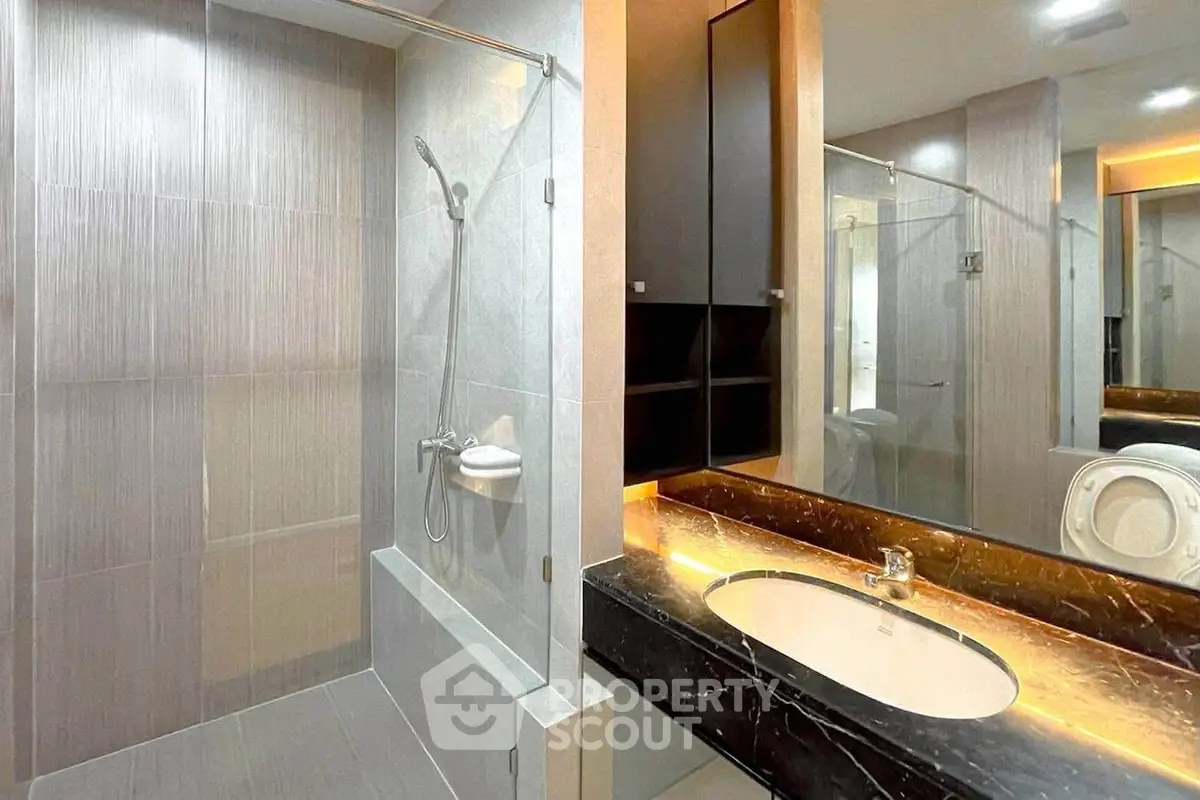 Modern bathroom with sleek design and elegant fixtures in a contemporary apartment.