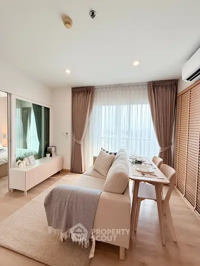 Bright and cozy living room with modern decor and large windows