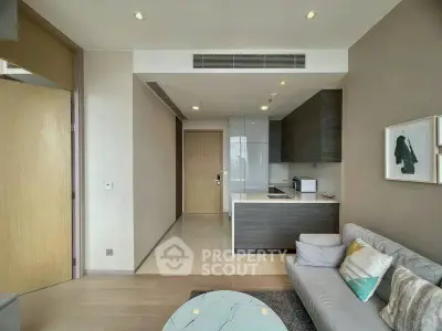 Modern living room with open kitchen layout and stylish decor