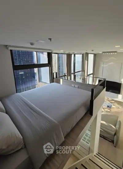 Modern loft bedroom with city view and stylish interior design