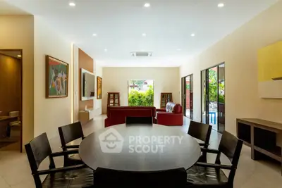 Spacious living room with modern decor and garden view