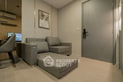 Modern living room with sleek gray sofa and stylish decor