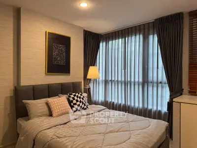 Cozy modern bedroom with stylish decor and ample natural light