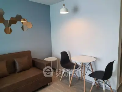 Modern living room with stylish furniture and geometric wall decor