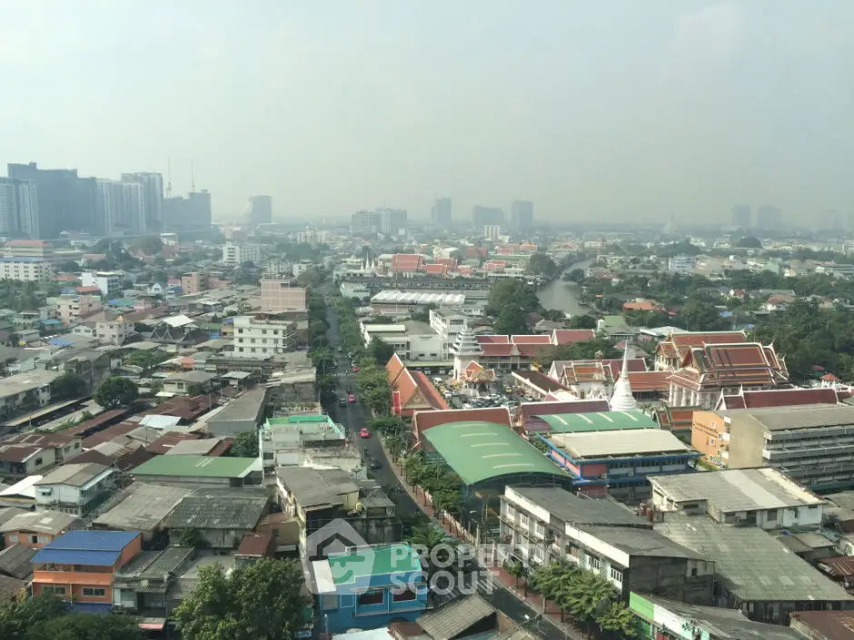 Panoramic cityscape view showcasing diverse architecture and urban landscape.