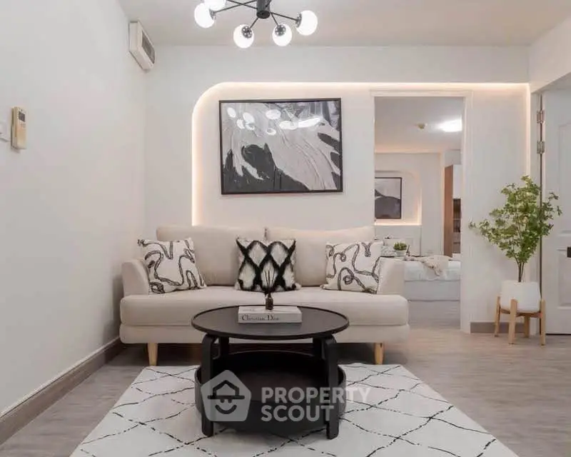 Modern living room with stylish decor and cozy seating area, perfect for relaxation and entertaining.