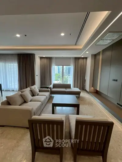 Spacious modern living room with elegant furniture and city view.