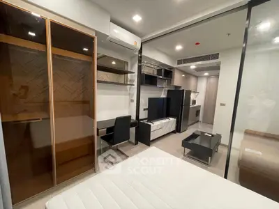 Modern studio apartment with sleek design and built-in storage solutions