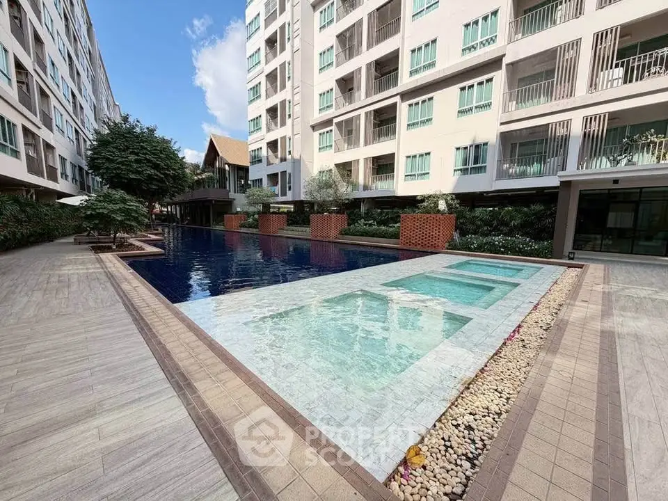 Luxurious condominium with stunning pool and modern architecture