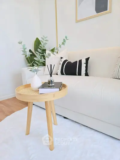 Stylish living room with cozy sofa and chic decor, perfect for modern living.