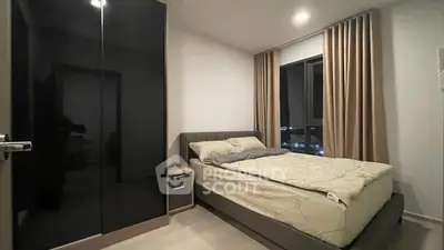 Modern bedroom with large wardrobe and city view window