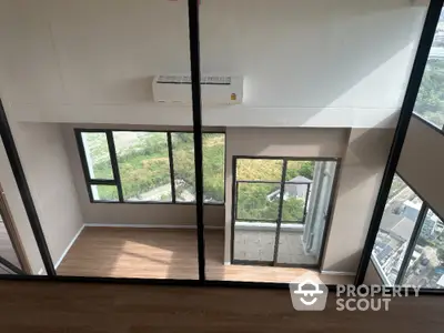 Spacious modern apartment with large windows and scenic view