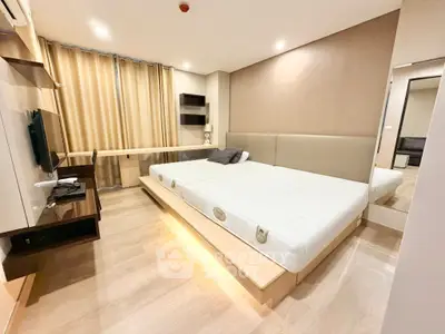 Spacious modern bedroom with sleek design and ample natural light
