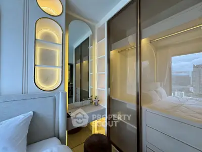 Modern bedroom with stylish built-in wardrobe and city view, featuring elegant lighting and cozy decor.