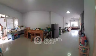 Spacious open-layout kitchen and dining area with modern appliances and ample natural light.