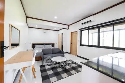 Modern studio apartment with sleek design and ample natural light