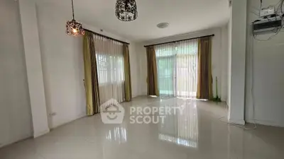 Spacious empty living room with elegant curtains and polished tile flooring