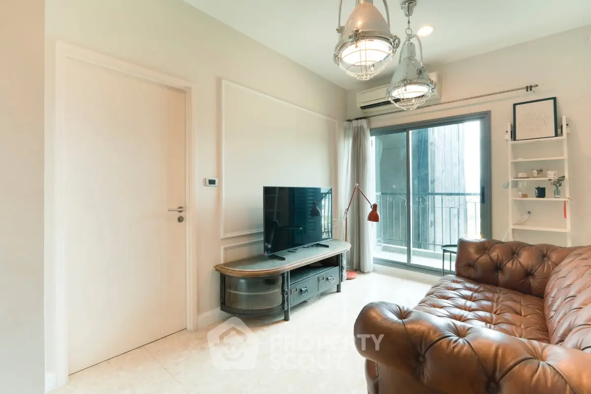 Stylish living room with leather sofa and balcony access in modern apartment