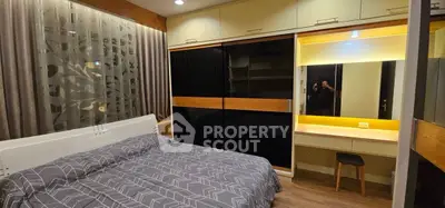 Modern bedroom with stylish decor and built-in wardrobe