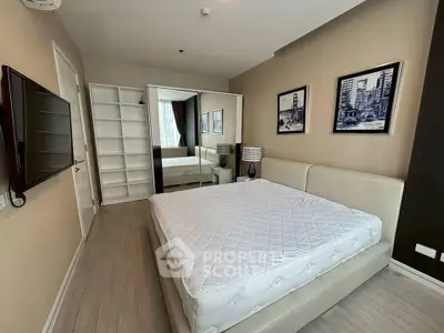 Modern bedroom with stylish decor and ample storage space